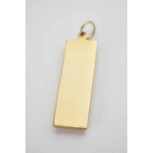 527 - 9ct gold ingot with full hallmarks to front, 2000, 53mm tall, 31.2 grams.