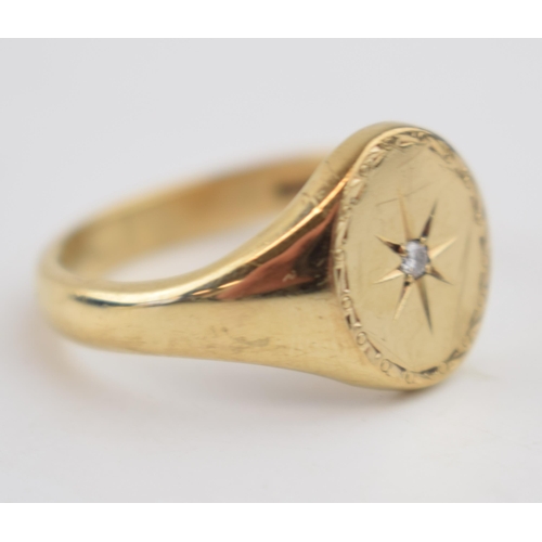 534 - 9ct gold gents ring set with diamond chip amongst star decoration, size X, 8.7 grams.