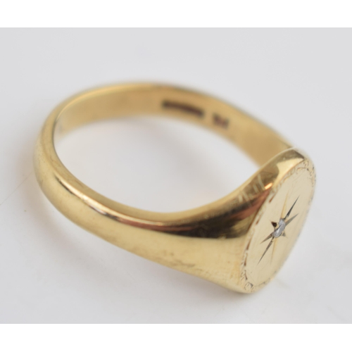 534 - 9ct gold gents ring set with diamond chip amongst star decoration, size X, 8.7 grams.