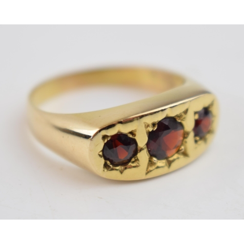 545 - 9ct gold gypsy ring set with 3 garnets, size Y/Z, 6.4 grams.