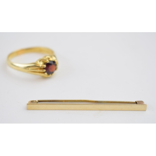 547 - 9ct gold ring set with central garnet, size X, together with a 9ct gold tie pin with metal pin, 1.8 ... 