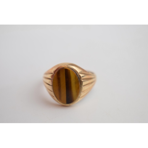 548 - A 9ct gold gents ring set with tigers eye, Z+1, 7.4 grams with an 18ct gold ornate ring set with pol... 