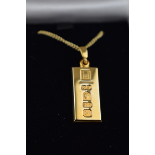 549 - 9ct gold Jubilee ingot on 9ct gold chain, hallmarked to front of ingot, 11.2 grams.