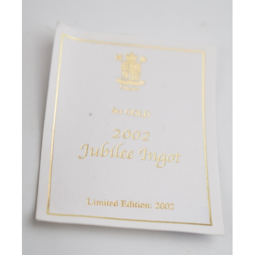 549 - 9ct gold Jubilee ingot on 9ct gold chain, hallmarked to front of ingot, 11.2 grams.