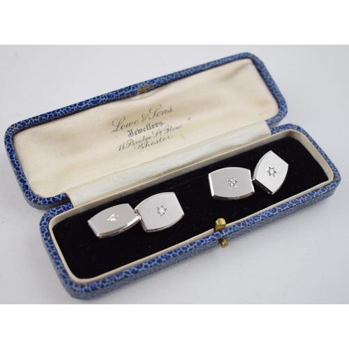 581 - 14ct white gold diamond set cufflinks, 4 x diamonds, each about 4 points.  Stamped .585.  Weight 12.... 