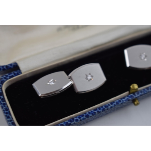 581 - 14ct white gold diamond set cufflinks, 4 x diamonds, each about 4 points.  Stamped .585.  Weight 12.... 