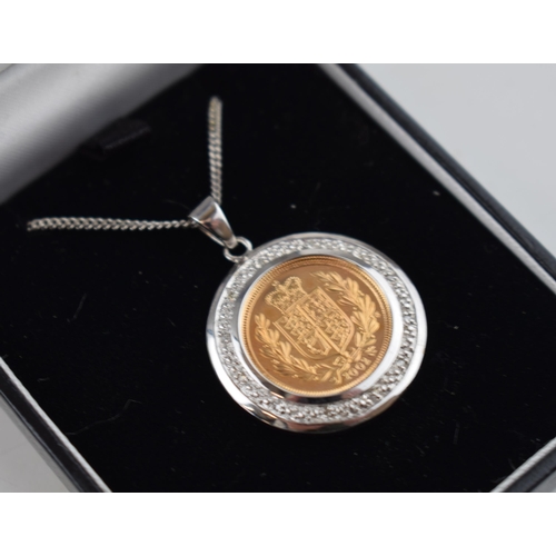 584 - Half sovereign gold coin 2002, loose mounted  in 9ct white gold mount set with white stones, togethe... 