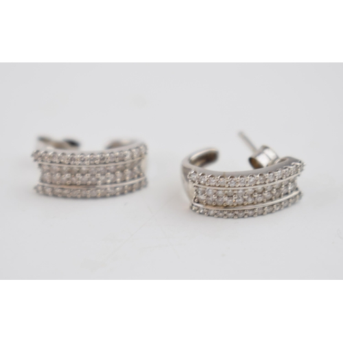 601 - Diamond and 9ct white gold earrings containing a total of 48 small diamonds in EACH earring.  Despit... 