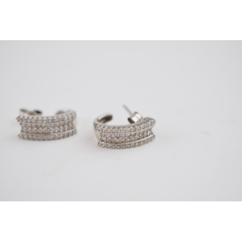 601 - Diamond and 9ct white gold earrings containing a total of 48 small diamonds in EACH earring.  Despit... 