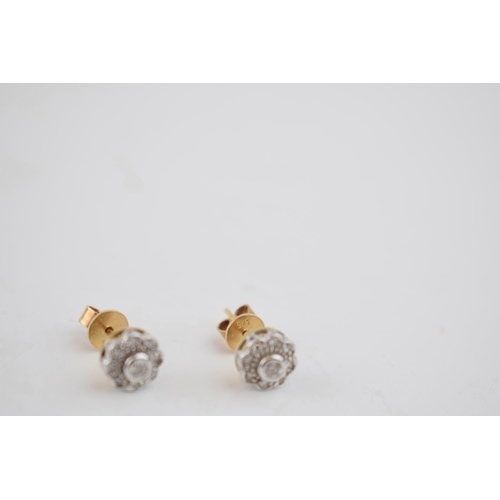 602 - Diamond and 9ct yellow gold daisy head earrings with white gold face and setting, containing a total... 