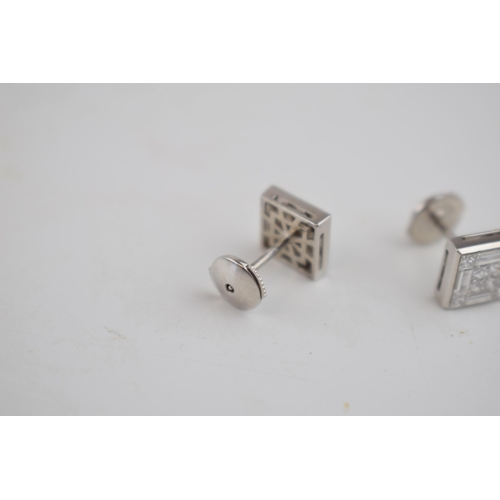 603 - Diamond and 18ct white gold hallmarked designer high quality earrings containing a total of 8 small ... 