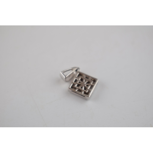 605 - 18ct white gold pendant set 12 diamonds –8 x square & 4 x baguette.  Face measures 9mm x 9mm.  Hallm... 