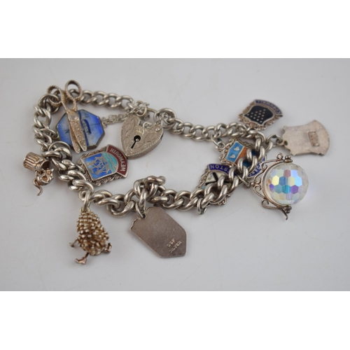 607 - Antique silver bracelet hallmarked on every link. With later silver fobs to include hedgehog, scisso... 