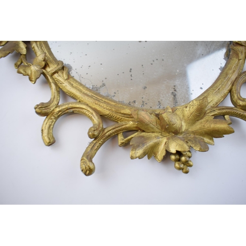 289 - Victorian or earlier carved wooden wall hanging mirror with grape and vine decoration, gilt finish, ... 