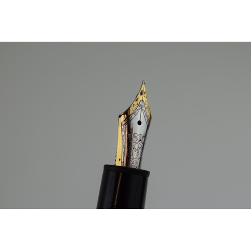 342 - A Montblanc Meisterstuck 146 Fountain Pen in black with one broad and two narrow gold bands, 14ct wh... 