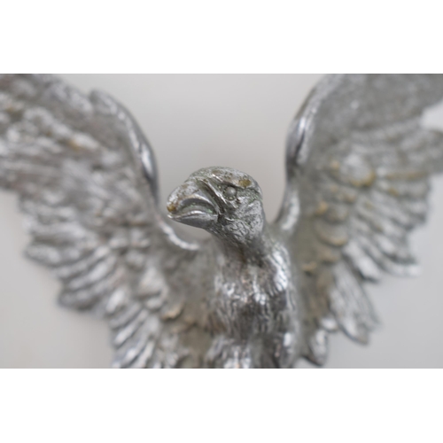 237A - A chrome plated car mascot in the form of an eagle with spread wings, 16cm wide.