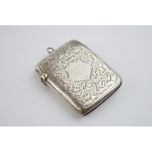 553 - Silver engraved vesta case with vacant cartouche, Birmingham 1901, 25.7 grams.