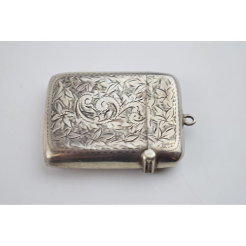 553 - Silver engraved vesta case with vacant cartouche, Birmingham 1901, 25.7 grams.