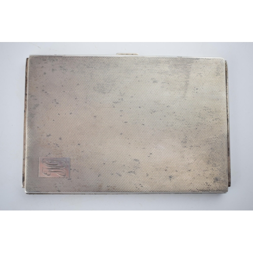 557 - Heavy silver cigarette case with engineered decoration, 201.5 grams, Birmingham 1921.