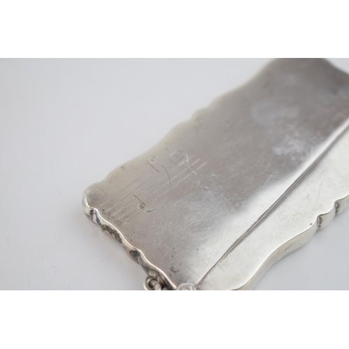 559 - Silver card case with musical engraving, 50.0 grams, Birmingham 1913.