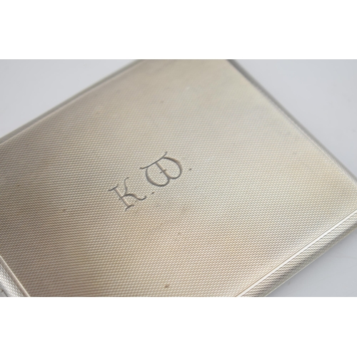 560 - Silver cigarette case, Birmingham 1957, 123.4 grams.