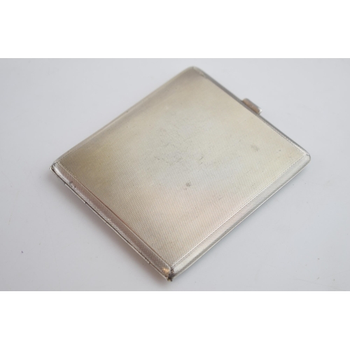 560 - Silver cigarette case, Birmingham 1957, 123.4 grams.