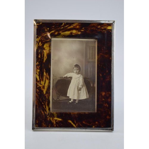 562 - Edwardian silver and tortoiseshell (or similar) photo frame, Birmingham 1902, 20cm tall.