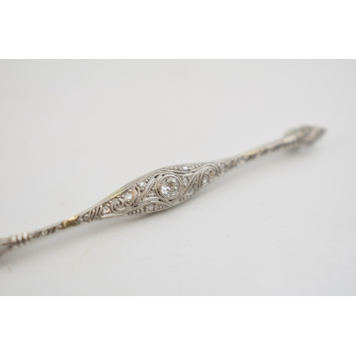 564 - Art Deco white gold (tests as 9ct or better) brooch set with diamonds, 3.2 grams, 6.5cm long.