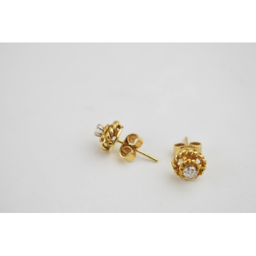 566 - A pair of 9ct gold ornate earrings, set with diamonds, 1.7 grams.