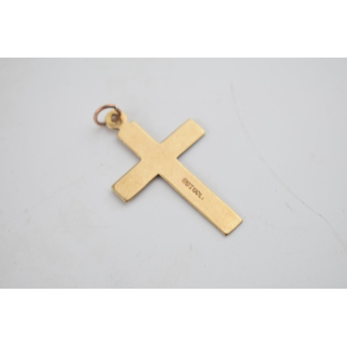 570 - 9ct gold cross pendant, 1.3 grams, 34mm long.