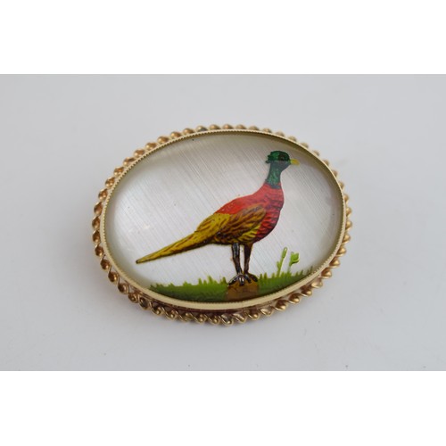 494 - ‘Essex crystal’ type gold mounted brooch depicting a male pheasant (mount tested as 9ct gold), late ... 