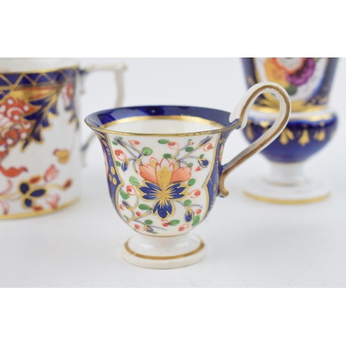 100 - An early 19th century Derby porcelain coffee can and similar style cup and footed vase, c.1810-30. V... 