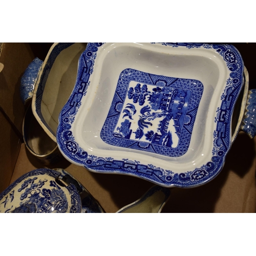 107 - A group of 19th century blue and white transfer printed Willow pattern wares, to include sauce turee... 