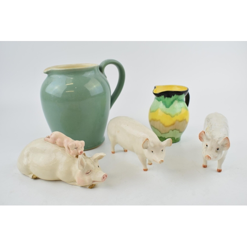 125 - A collection of Beswick pigs to include 'Wall Queen','Wall Champion Boy' and another example with a ... 