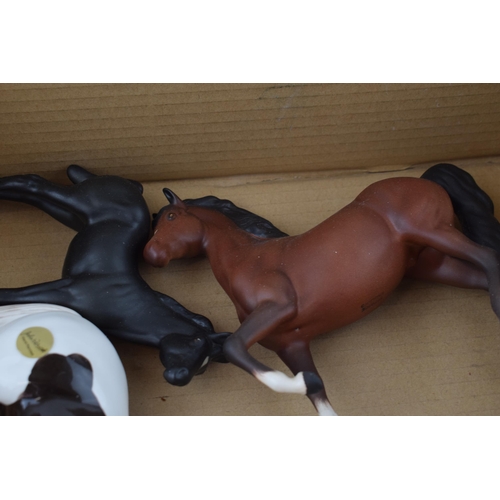 128 - Beswick horses to include a matte prancing arab, a grey matt thoroughbred, a pair of black matt foal... 