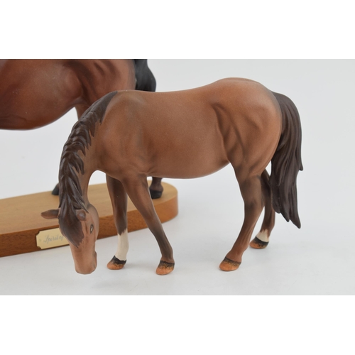 130 - Beswick to include a New Forest Pony DA244 (Doulton backstamp) with a Spirit of Freedom on base (2).