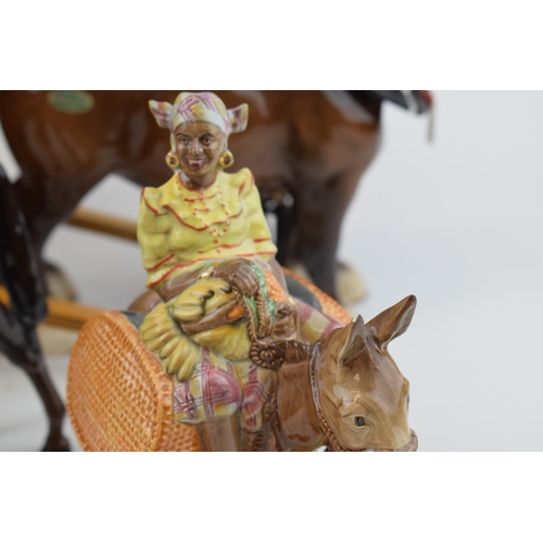 134 - Beswick to include Susie Jamaica (ear chipped), an 818 shire horse with tack and cart, with a brown ... 