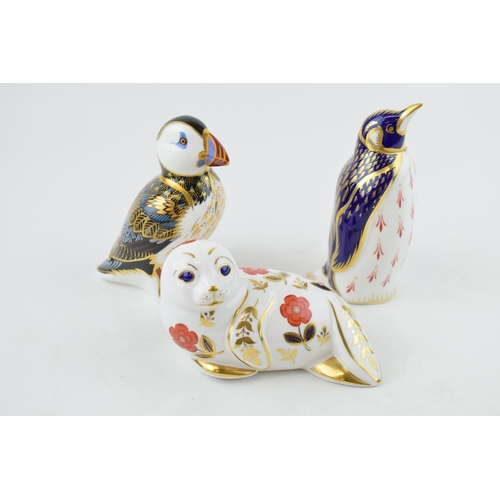 14 - Three Royal Crown Derby paperweights, Puffin, date code for 1998 (LXI), silver stopper and red print... 