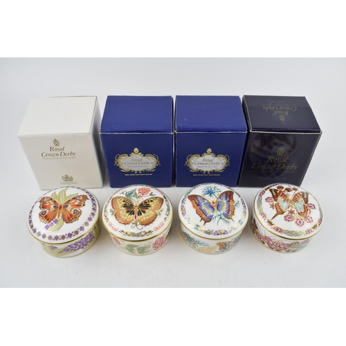 16 - A set of four Royal Crown Derby Butterflies of The World circular trinket pots and covers, comprisin... 