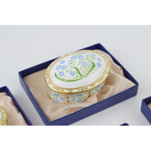 17 - A set of four Royal Crown Derby Forget-Me-Not pattern graduated oval trinket dishes and covers, the ... 