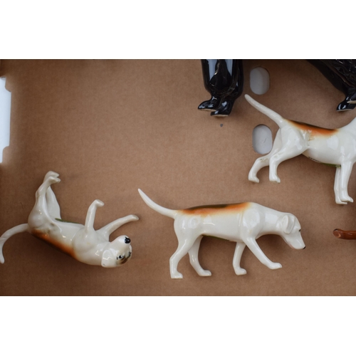 171 - Beswick animals to include foxhounds, 2 foxes, an Airedale terrier and a poodle (7).