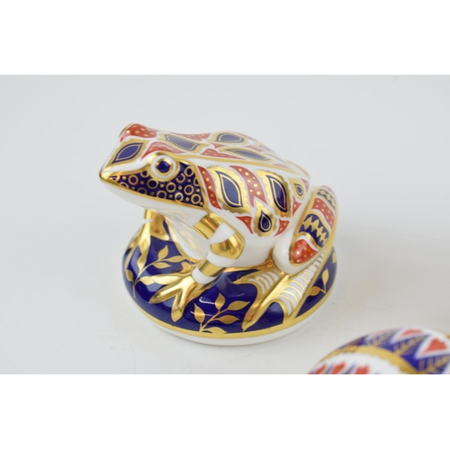 22 - Three Royal Crown Derby Paperweights, Frog, decorated in the Imari palate, gold stopper, a Hedgehog,... 