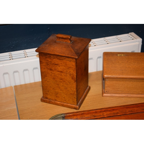 525 - A two handled tray in light oak together with two boxes. (3)