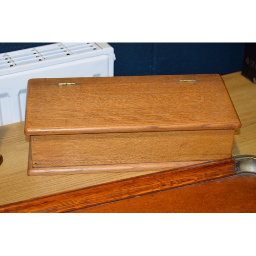 525 - A two handled tray in light oak together with two boxes. (3)