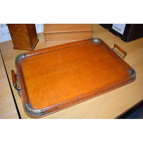 525 - A two handled tray in light oak together with two boxes. (3)