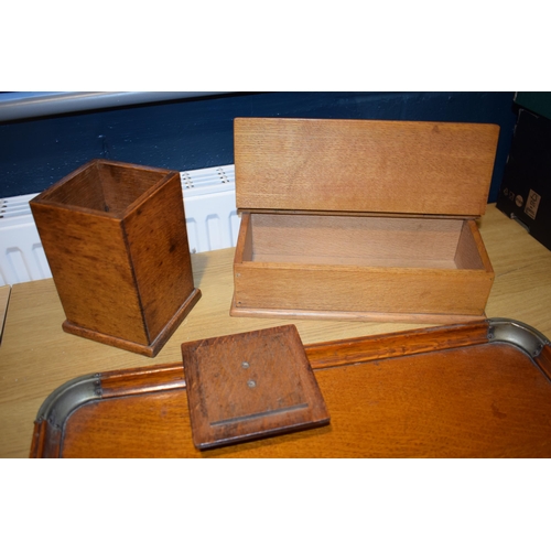 525 - A two handled tray in light oak together with two boxes. (3)