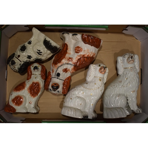 69 - A collection of ceramics to include two pair of Staffordshire Dogs and another single dog.