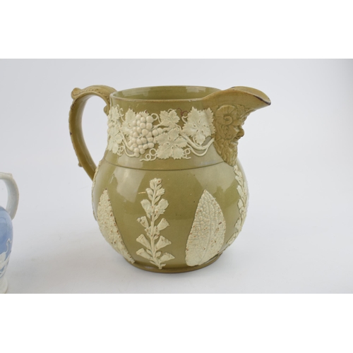 87 - A group of three early 19th century moulded jugs, c. 1810-30. To include a Davenport feldspathic hun... 