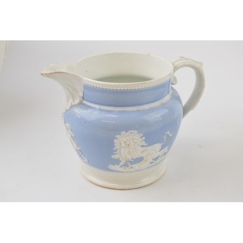 87 - A group of three early 19th century moulded jugs, c. 1810-30. To include a Davenport feldspathic hun... 