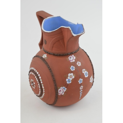 88 - An early 19th century moulded stoneware terracotta G R Booth jug, c. 1839. It has hand-painted flowe... 